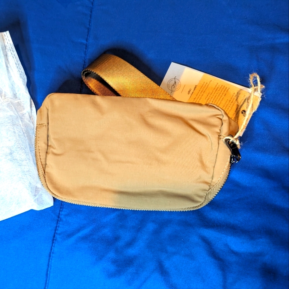 Ampere belt bag in three colors.  Black, Tan, and  orange tan NWT!